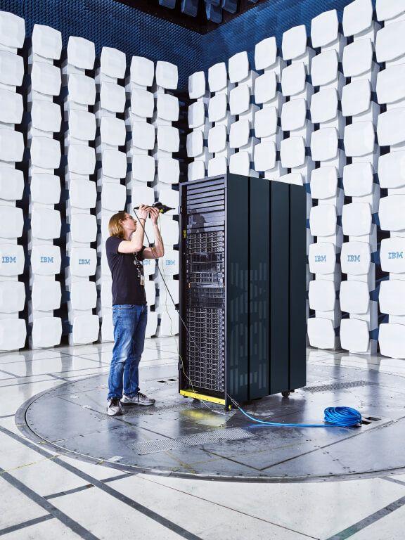 portrait of IBM employee in anechoic test chamber with server portrait of IBM employee in anechoic test chamber with server